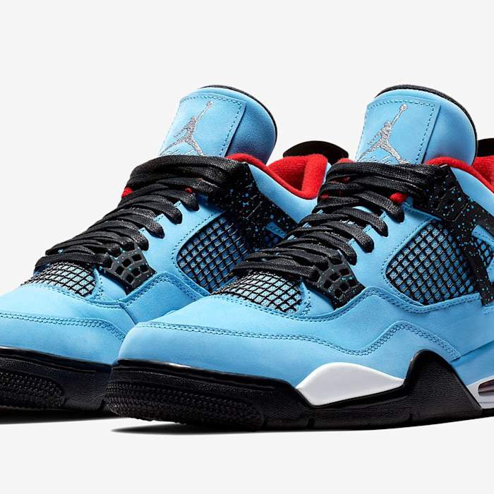 Blue and black Travis Scott x Air Jordan shoes.